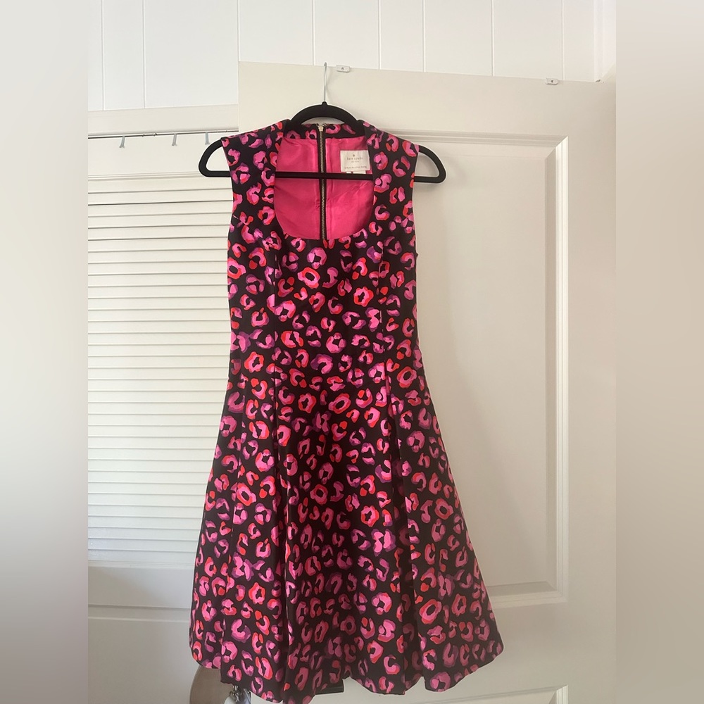 Kate Spade dress with stunning pleats. Subtle fit and flare, shows off waist.